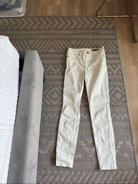 Blank NYC midrise skinny white jeans with one rip